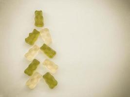 tree made of gummy candies. Christmas tree made of white and green gelatin bears. marmalade treats, sweet and delicious dessert. fruit jelly photo