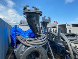 A large pump with an impeller and an impeller stands in a storage warehouse prepared for installation of industrial metal equipment for an oil refinery and petrochemical plant photo