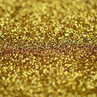 Orange decorative sequins. Background image with shiny bokeh lights from small elements photo