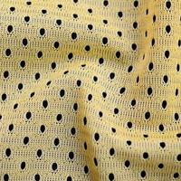 Yellow sport jersey clothing fabric texture and background with many folds photo