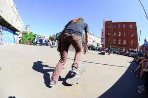 KHARKIV, UKRAINE - 27 MAY, 2018 Skateboarding contest in outdoors skate park during the annual festival of street cultures photo