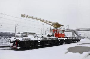 KHARKIV. UKRAINE - APRIL 4, 2017 Unexpected rapid fallout of snow in April on the Kharkov streets photo