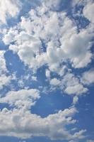 Beautiful blue sky background template with some space for input text message below isolated on blue photo
