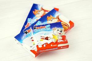 KHARKOV. UKRAINE - MAY 2, 2019 Kinder small Chocolate bars in paper wrappings made by Ferrero SpA. Kinder is a confectionery product brand line of Italian multinational manufacturer Ferrero photo