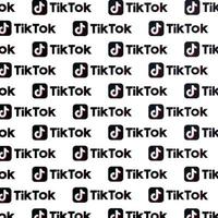 TERNOPIL, UKRAINE - MAY 2, 2022 Many TikTok logo printed on paper. Tiktok or Douyin is a famous Chinese short-form video hosting service owned by ByteDance photo