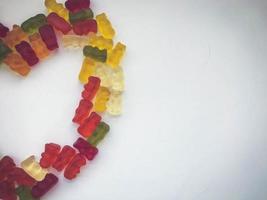 half heart made of colored marmalade. Valentine's Day. macro photography. colored candies, bright dessert in honor of the holiday. mouth-watering treat photo