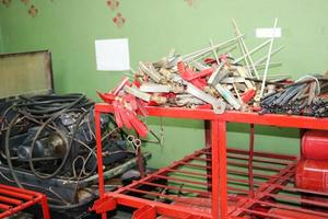 Spare parts for fire extinguishers at the refueling station of fire extinguishers, locking-starting devices, pipes and cylinders at an industrial plant photo