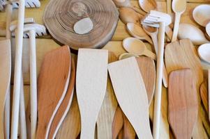 Natural wooden traditional kitchen appliances, dishes, spoons, shovels. The background photo