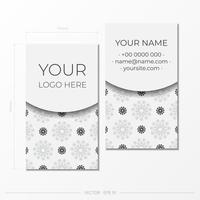 The business card is white with black ornaments. Print-ready business card design with space for your text and abstract patterns. vector