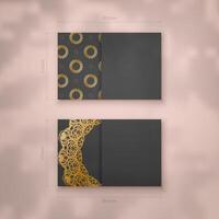 A presentable business card in black with an antique gold pattern for your contacts. vector