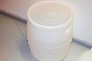 Large plastic white barrel of high-pressure polyethylene. Plastic production photo