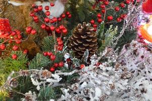 Christmas decor for a shopping center. cute decoration of artificial trees. Christmas wreath. spruce branches are decorated with beads and colorful balls photo