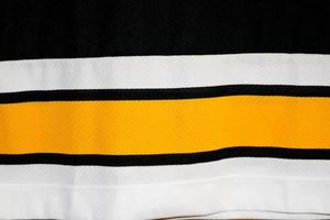 textura de un tejido alemán sintético multicolor blanco amarillo negro. el fondo foto