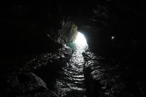 Grottoes in the chalk cliffs on the shores of the Mediterranean Sea. photo