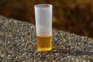 A non-alcoholic soft drink is poured into a glass. photo