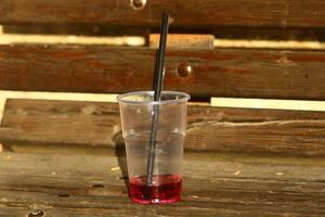 A non-alcoholic soft drink is poured into a glass. photo