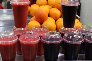 A non-alcoholic soft drink is poured into a glass. photo