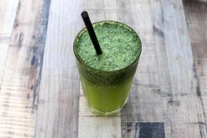 A non-alcoholic soft drink is poured into a glass. photo