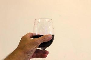 A non-alcoholic soft drink is poured into a glass. photo