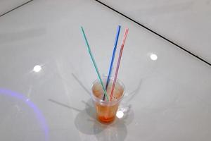 A non-alcoholic soft drink is poured into a glass. photo