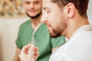 Man receives nasal inhalation. photo