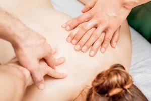 Massage with four hands. photo