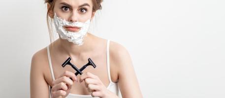 Woman with shaving foam on her face photo