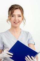 Young woman holding blue folder photo