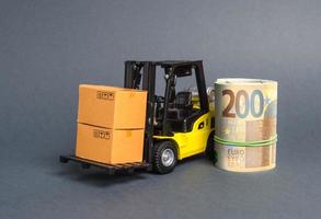 A forklift truck carries cardboard boxes and Euro roll. Transport company. Performance efficient. Trade and production of products and goods, balance import export. development of the global economy photo