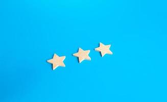 Three rating stars. Rating evaluation concept. Service quality. High satisfaction. Popularity of a restaurant, hotel or mobile applications. Good reputation status. Buyer feedback. photo