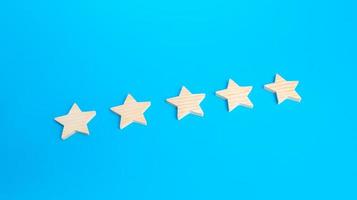 Five rating stars. Rating evaluation concept. High satisfaction. Popularity of restaurants, hotels or mobile applications. Highest score. Service quality feedback. Good reputation. photo