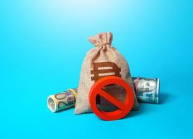 Philippine peso money bag and prohibition sign NO. Sanctions and restrictions. Confiscation of capital of illegal origin. Monitoring of suspicious transactions. Freezing of assets, seizure of savings. photo