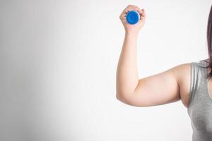 Overweight women exercising on a white background. Isolated background. photo