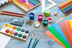 School supplies on a blue background photo