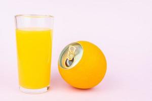 Orange juice on pink background photo