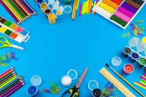 School supplies on a blue background photo