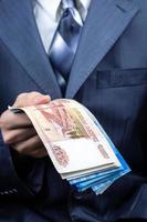 businessman holding money hand photo