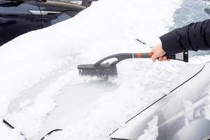 cleaning the car from snow photo