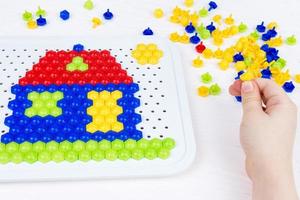 child building a mosaic house photo