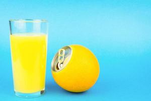 Orange juice on blue background photo