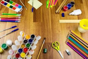 School supplies on a brown background photo