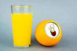 Orange juice on grey background photo