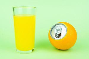 Orange juice on green background photo