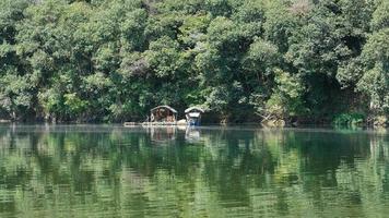 The beautiful countryside view with the clear river and mountains as background in the countryside of the China photo