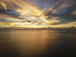 Aerial dramatic sunset at sea photo