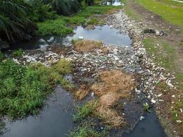 Aerial view pollution of rubbish at river photo