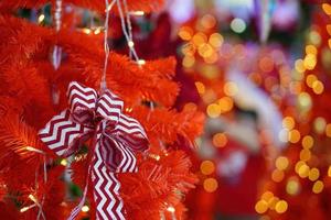 Ribbon display at red Christmas tree. photo