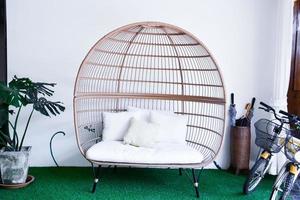 Living room interior with birdcage sofa, soft and selective focus. photo