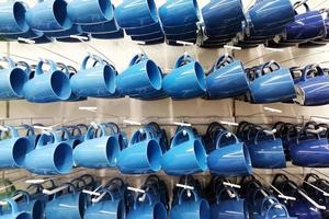 colorful cup store. cups of different colors standing In shop photo