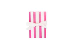 Christmas or other holiday handmade present in pink paper with white ribbon. Isolated on white background, top view. thanksgiving Gift box concept photo